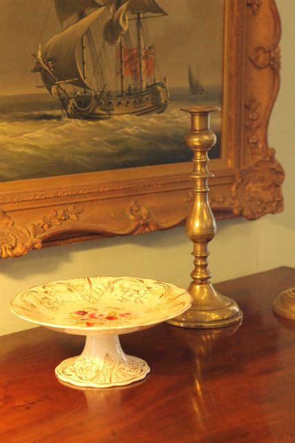 Antique candle holder and antique cake stand at Chantecleer Antiques in Dorking, Surrey